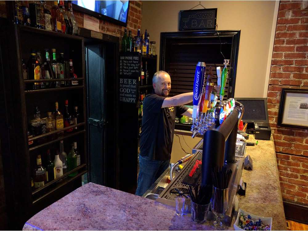 mike-chaput-pulling-a-beer-on-tap-at-lancienne-banque-chape